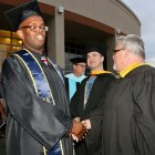 Tyler Reed is greeted by members of the West Hills College Lemoore faculty outside the Golden Eagle Arena Thursday night.